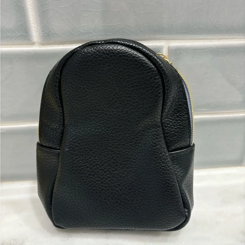 Bath & Body Works penguin cosmetic bag in black and white faux leather